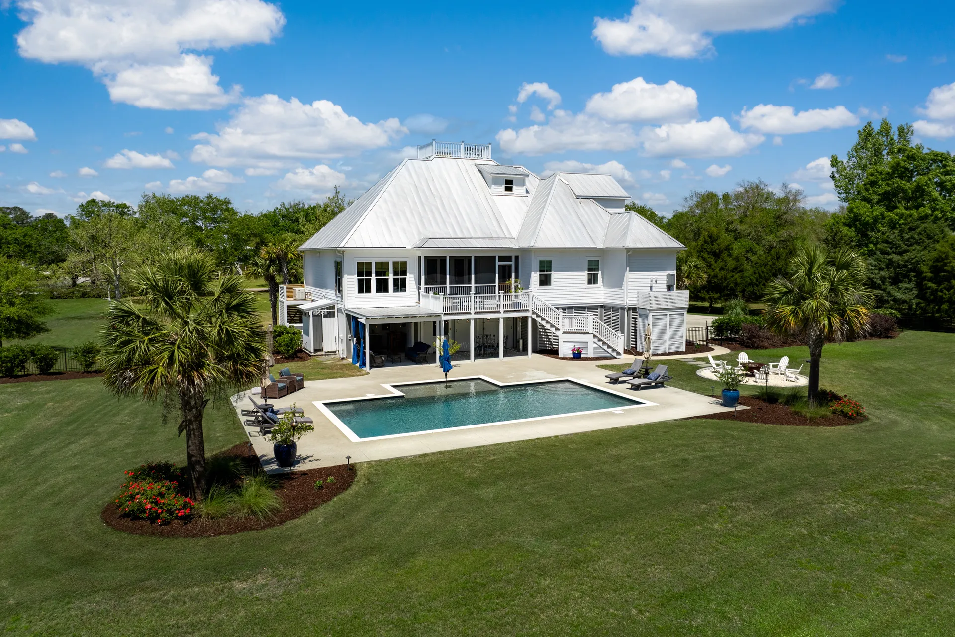 Large property with pool and manicured lawn